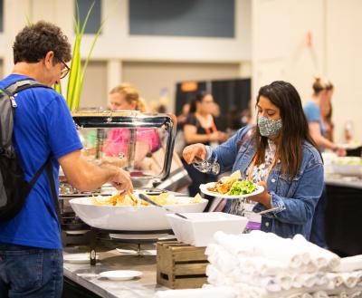 Conference attendees enjoy a vegan lunch